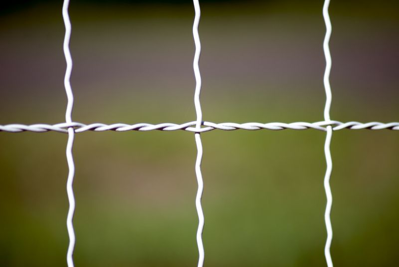 Woven Wire Fence Installation in Spring